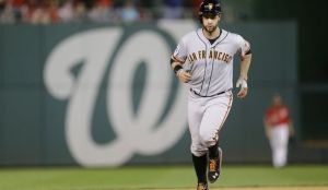 Brandon Belt trots around the bases after hitting a solo home run in the 18th inning of the Giants 2-1 win in Saturday's NLDS game 2.