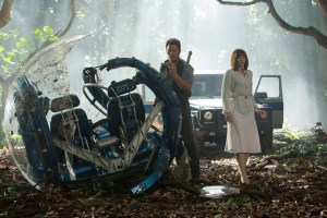 Owen Grady (Pratt) and Claire Dearing (Howard) inspect damage to the Gyrosphere by the Indominus Rex in Jurassic World.