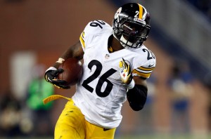 Nov 3, 2013; Foxborough, MA, USA; Pittsburgh Steelers running back Le'Veon Bell (26) runs the ball against New England Patriots strong safety Steve Gregory (28) during the second half at Gillette Stadium. Mandatory Credit: Mark L. Baer-USA TODAY Sports
