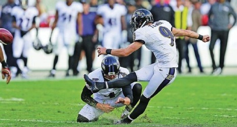 Baltimore kicker Justin Tucker (9) has a piece of turf buckle under him in the Ravens' game at the 49ers in 2015